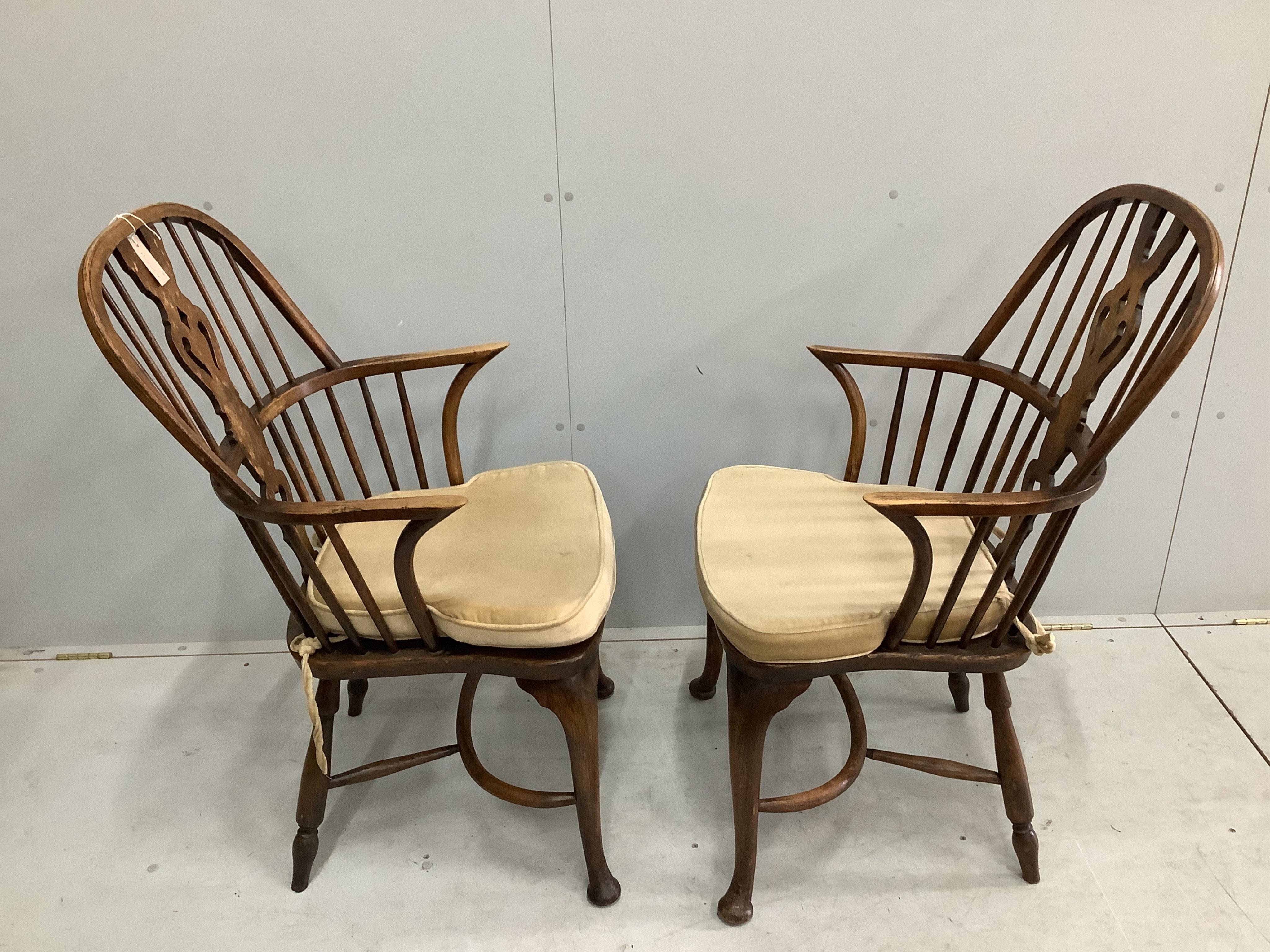 A set of eight reproduction elm and beech Windsor cabriole leg chairs, two with arms. Condition - fair